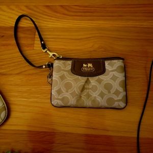 Gold coach wristlet